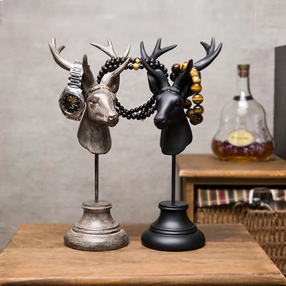 Natural resin animal sculpture home decoration in black, white, and wood colour finishes.