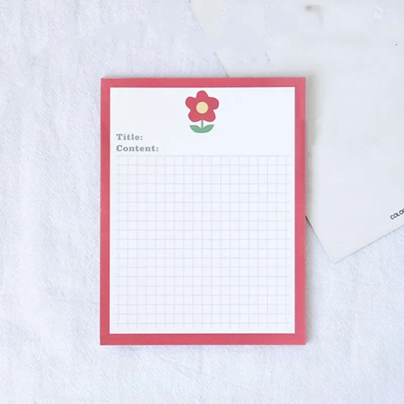 Cartoon sticky note pad in avocado or bear design, showing large and small size options next to a pen.
