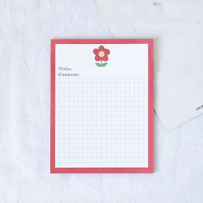 Cartoon sticky note pad in avocado or bear design, showing large and small size options next to a pen.