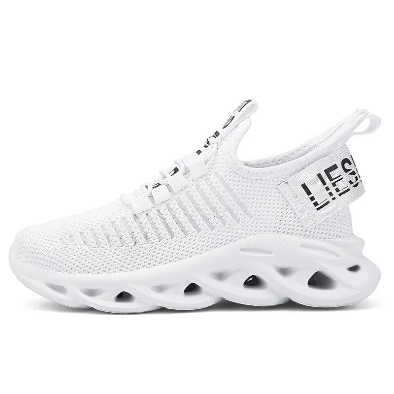 Children's black Velcro fasten coconut sneakers with breathable fabric upper and lightweight EVA sole.