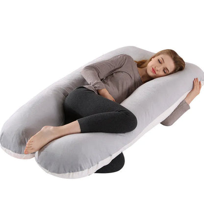 Large U-shaped pregnancy support pillow with removable cover and abdominal support belt.