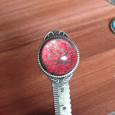 12cm handmade dried flower bookmark with gypsophila ruler featuring lace flowers, daffodils, and clover on blue background