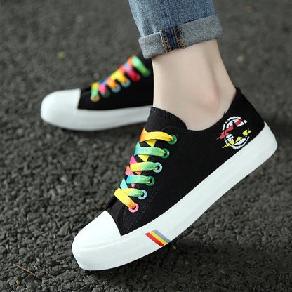 Classic canvas shoes in black and blue colours with lace-up closure and rubber sole