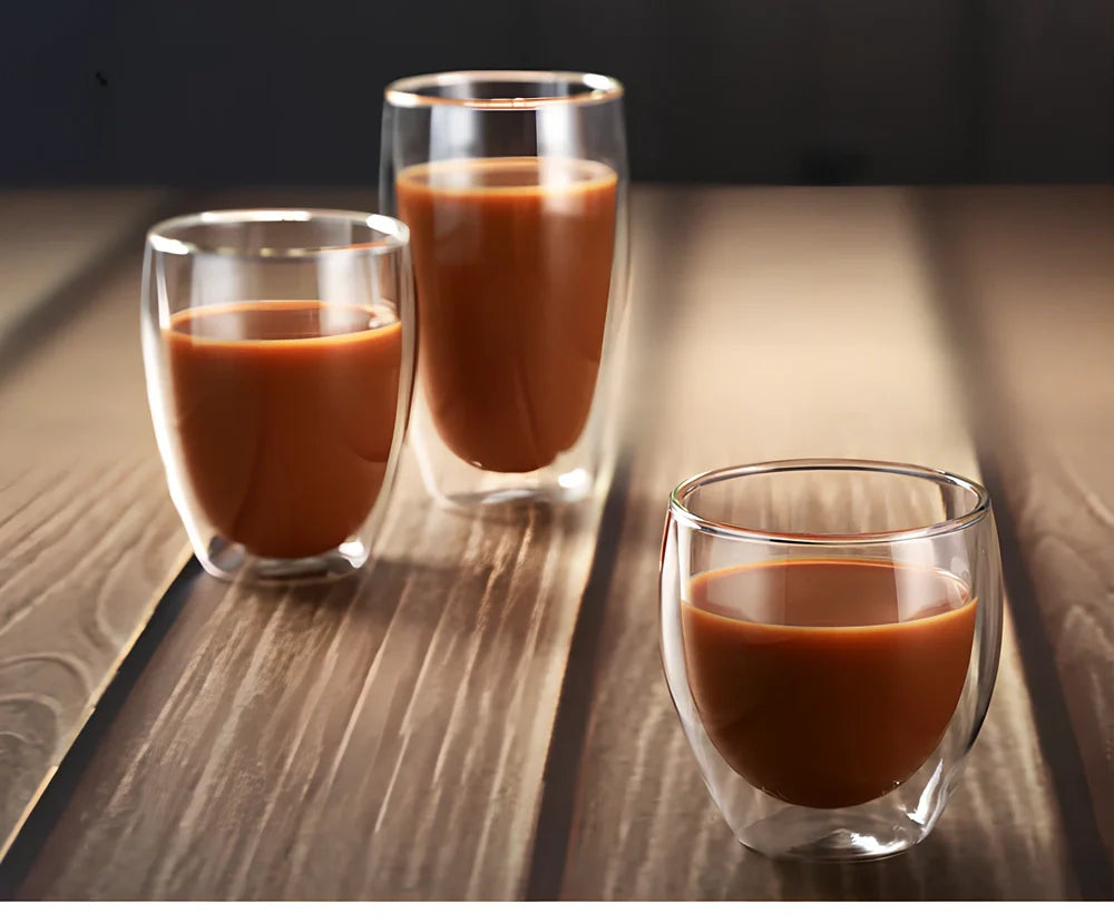 Clear double-layer glass coffee cup with Chinese-style design showing insulating air gap between walls