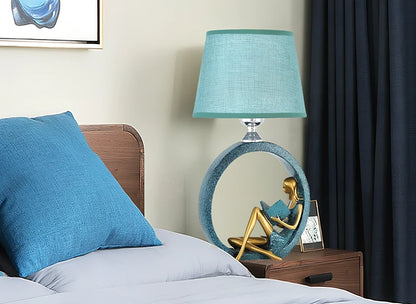 Blue reading night light with resin base and cloth shade measuring 20x39.8cm