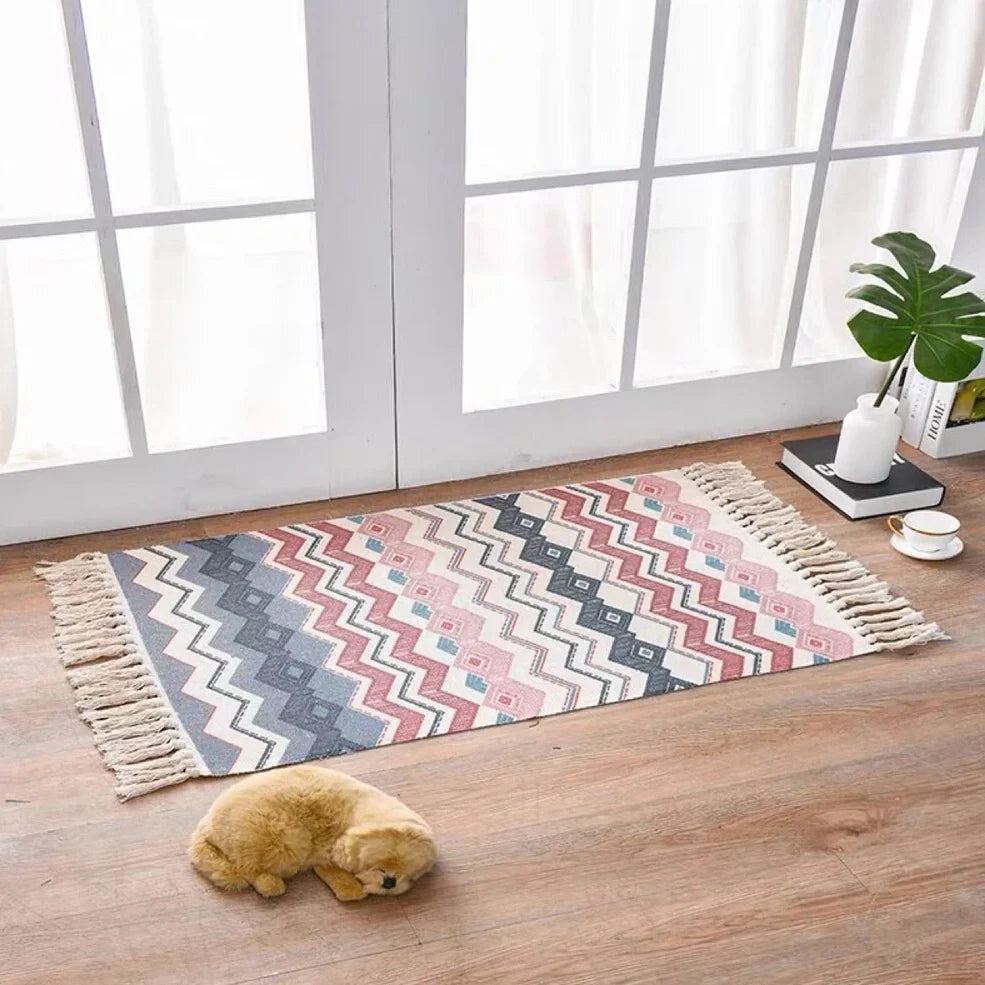 Hand-woven Scandinavian style linen cotton rug with woven tassels in plant-dyed colours measuring 60x90cm