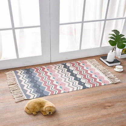 Hand-woven Scandinavian style linen cotton rug with woven tassels in plant-dyed colours measuring 60x90cm