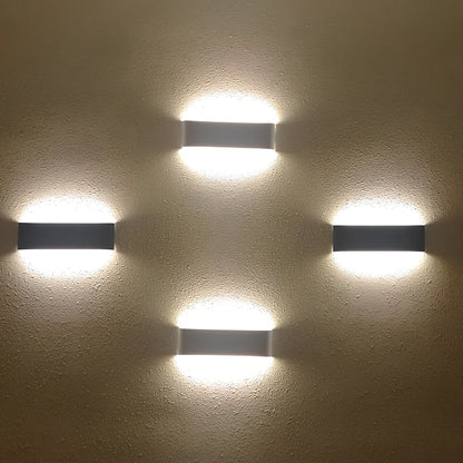 Slim 310mm wall light with aluminium alloy construction and 3000K warm LED illumination