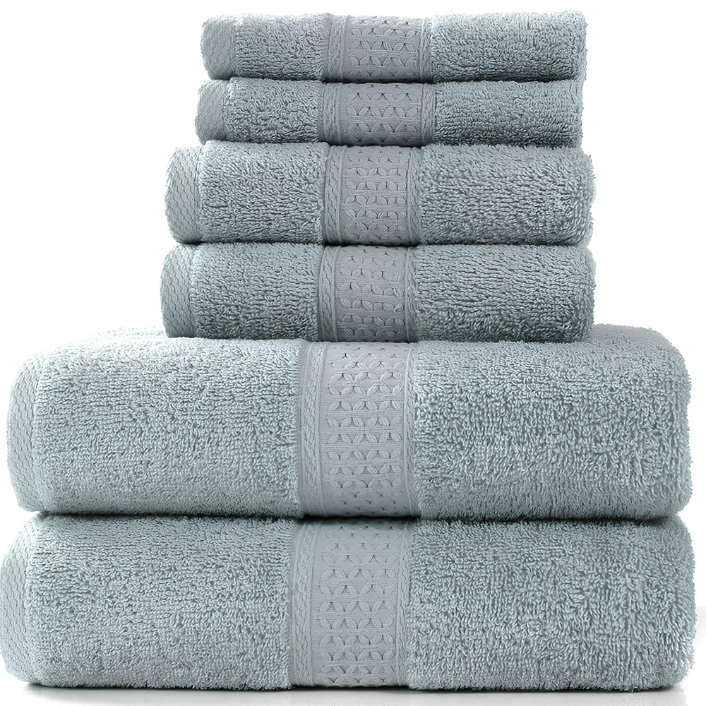 Cotton towel set showing bath towel, hand towel, and face cloth in coordinated sizes