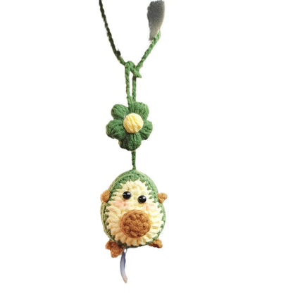 Handmade crocheted cartoon-style car pendant in wool, shown in avocado, pink rainbow, and red rainbow colour options.