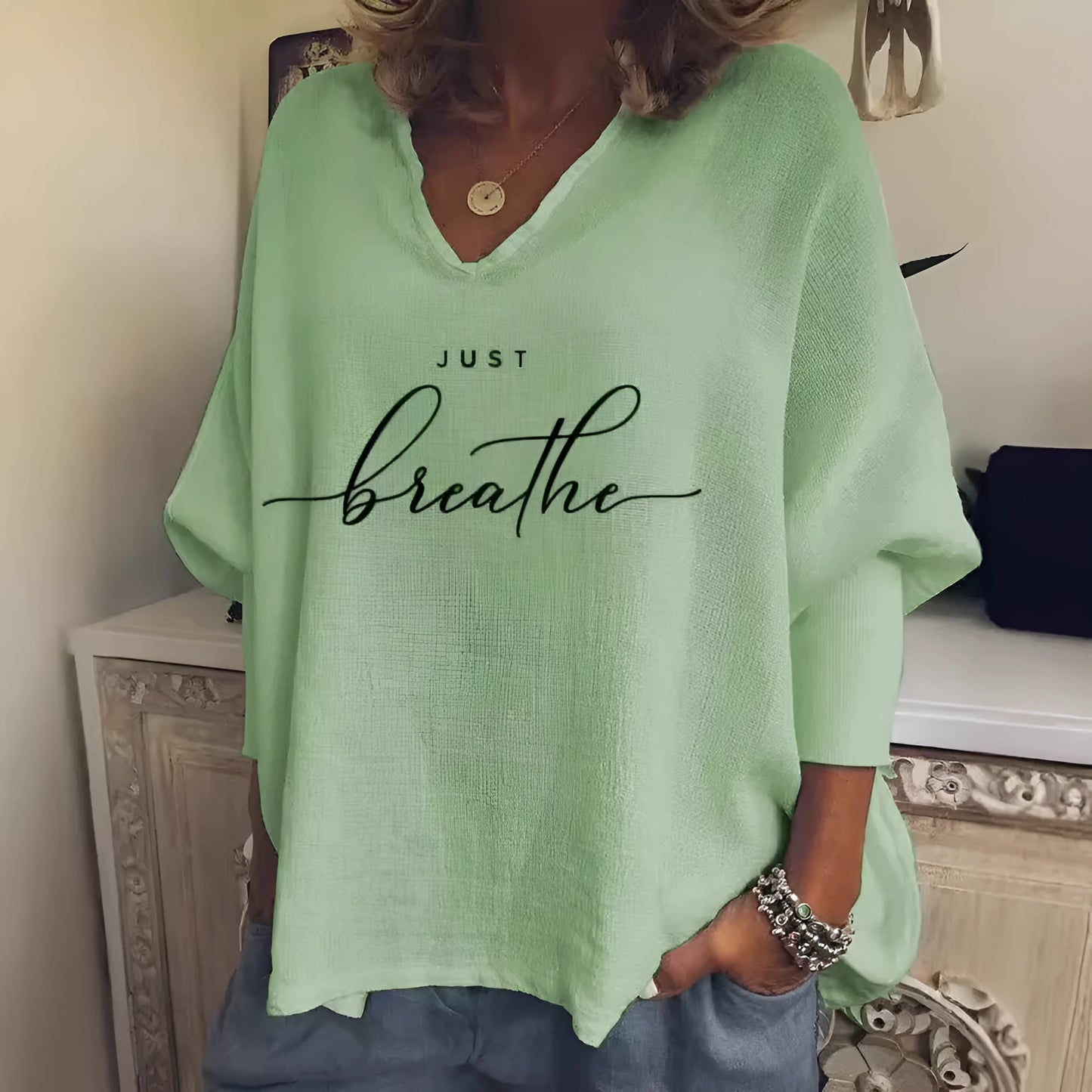 Women's loose-fit V-neck long sleeve top in brushed milk silk fabric for summer casual wear.