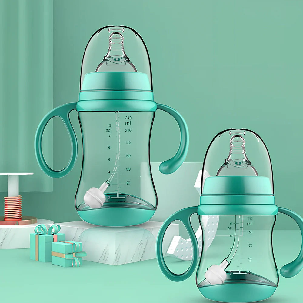 Baby feeding bottle with curved double handles in blue or pink, showing wide caliber opening and transparent PP construction