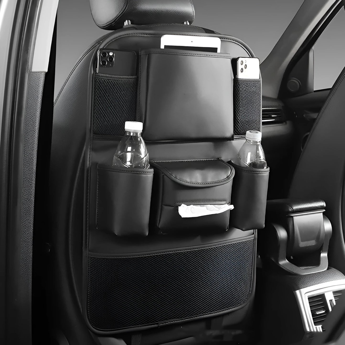 Genuine leather car seat back storage bag hanging from headrest, showing 20-litre capacity.