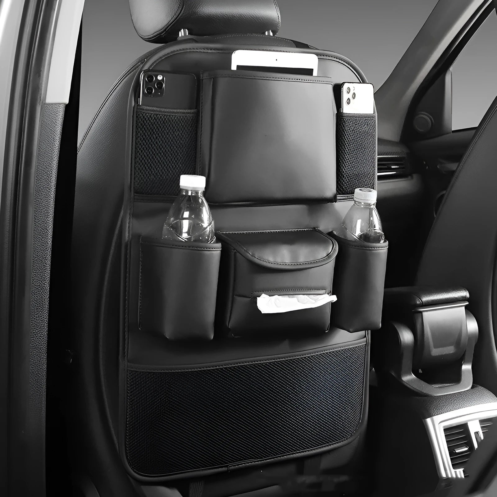 Genuine leather car seat back storage bag hanging from headrest, showing 20-litre capacity.