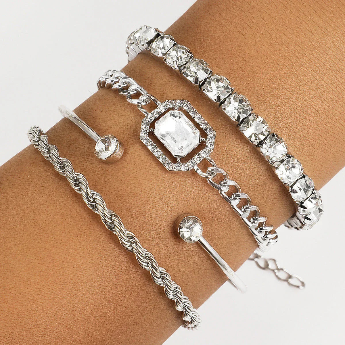 Sparkling crystal bracelets in various geometric designs, adorned with shimmering rhinestones for a luxurious and fashionable accessory