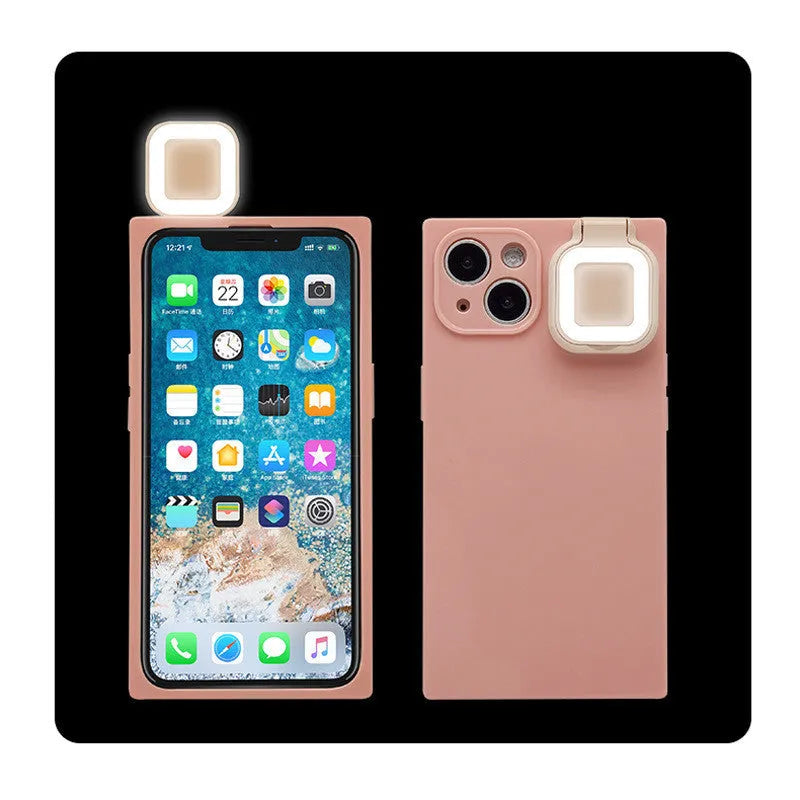 Pink mobile phone case with built-in ring flash light for Apple iPhone 13 models on a white background.