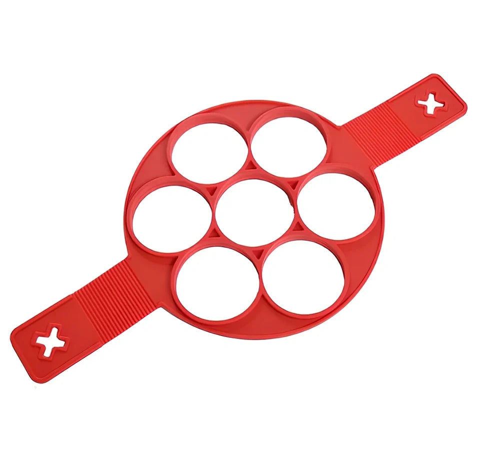 Red silicone egg mould measuring 3x3x6 inches for creating shaped hard-boiled eggs without shells