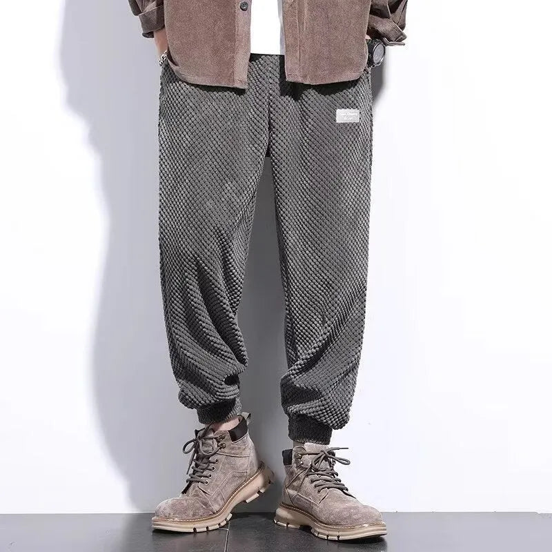 Men's grey casual sweatpants with ankle-tie design and straight leg cut