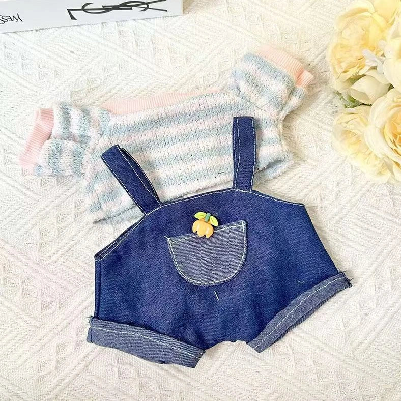 30cm doll clothing collection showing multiple outfit pieces including hooded jackets, sweaters, and suspender pants