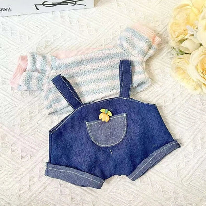 30cm doll clothing collection showing multiple outfit pieces including hooded jackets, sweaters, and suspender pants