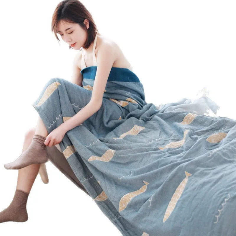 Pure cotton five-layer gauze bedspread blanket in Roulette Wheel Blue pattern on a bed.