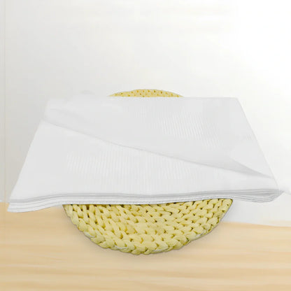 Pack of non-woven disposable bath towels 65x135cm with pearl pattern for absorbent drying