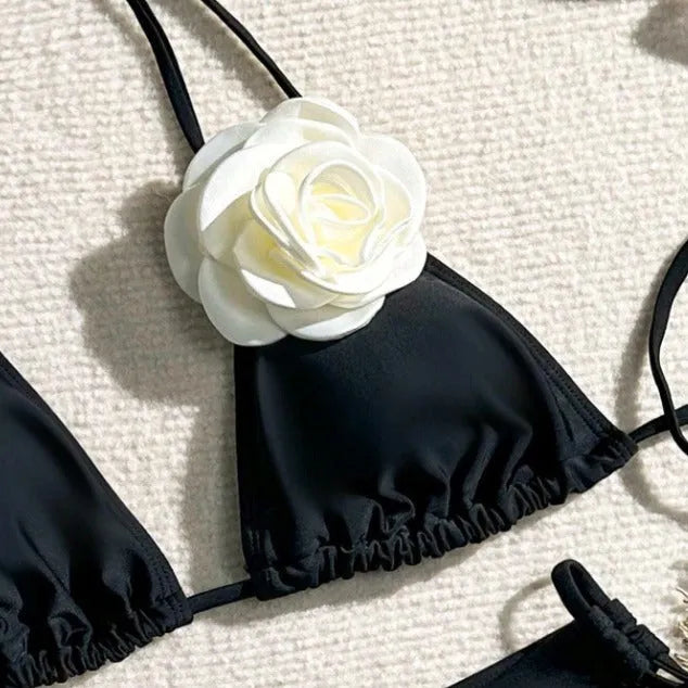 Black women's bikini set with 3D flower lace detailing and an adjustable drawstring waist.