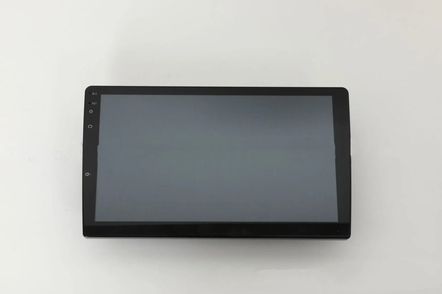 10.1 inch universal Android car stereo head unit with touch screen display for trapezoidal dashboard installation.