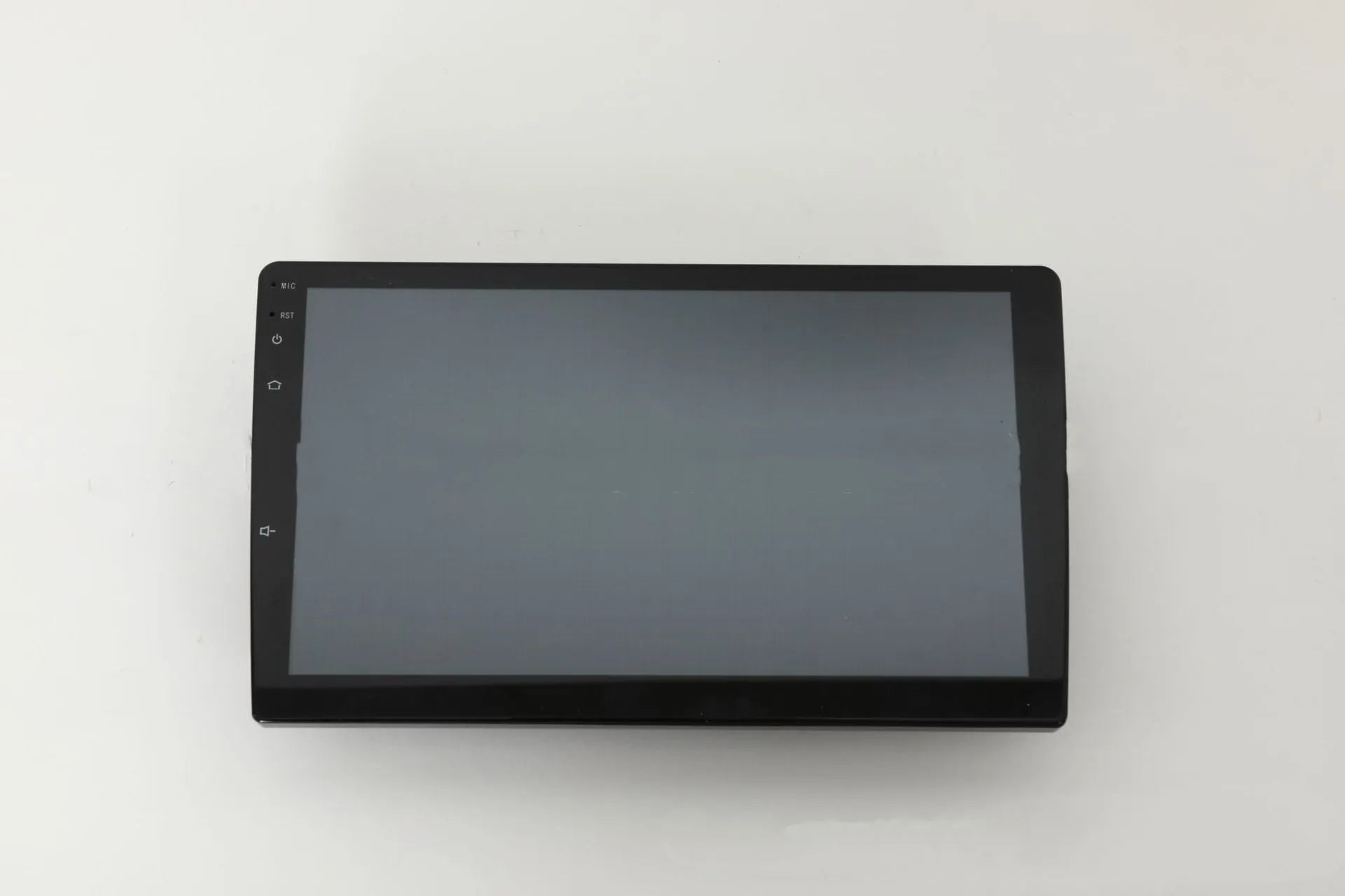 10.1 inch universal Android car stereo head unit with touch screen display for trapezoidal dashboard installation.