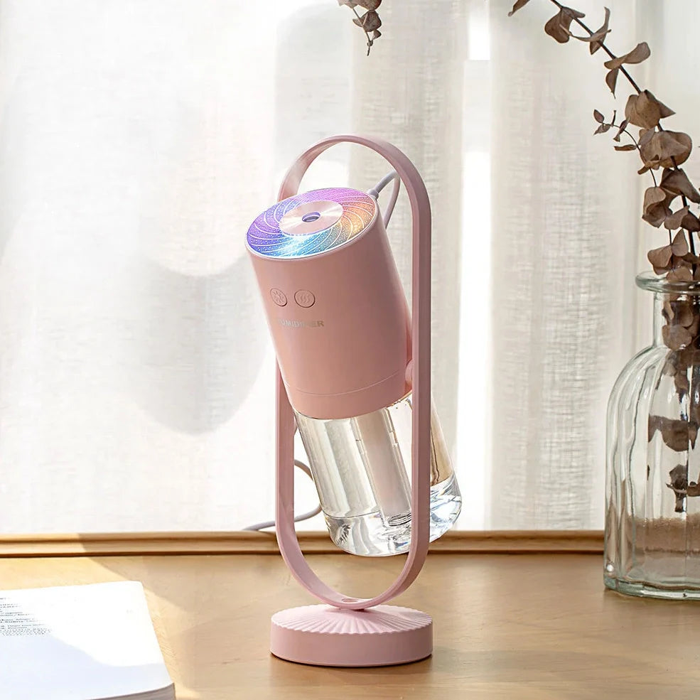 Portable USB humidifier with 200ml water tank in pink, blue, or white showing compact 70x66x213mm dimensions