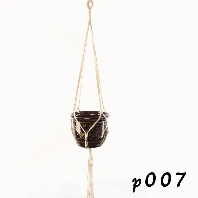 Woven wire lattice plant holder with natural cotton rope, shown in a rustic style supporting a green plant.