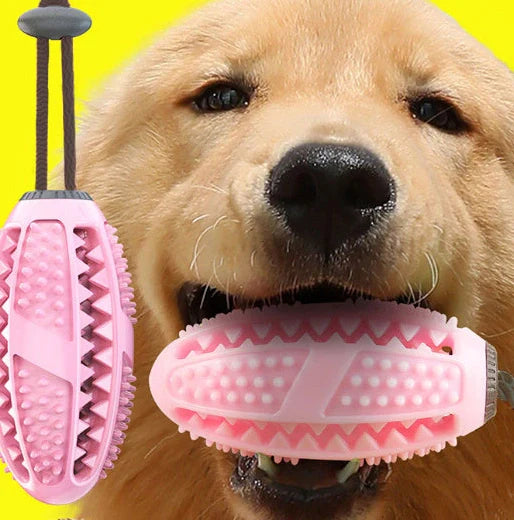 Red and blue silicone dog ball toy with suction cup attached to tile surface