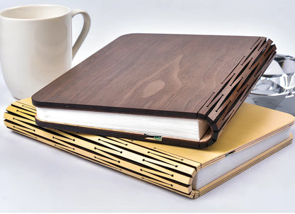 LED book lamp with wooden cover open at angle showing illuminated pages and USB cable