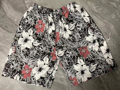 Men's floral printed swimming trunks in polyester fabric showing multiple pattern options for beach and pool use