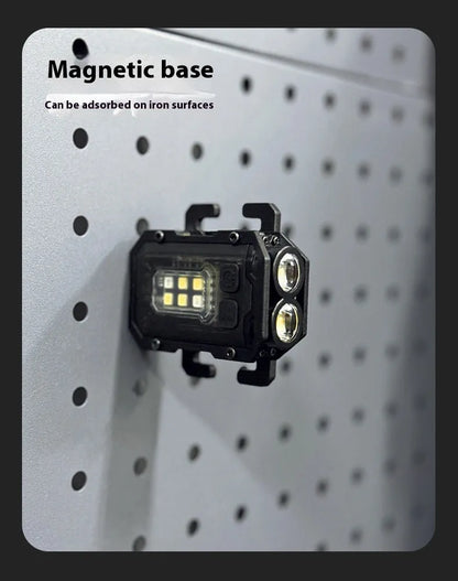 Compact black rechargeable tactical flashlight with USB charging cable for backpack mounting.