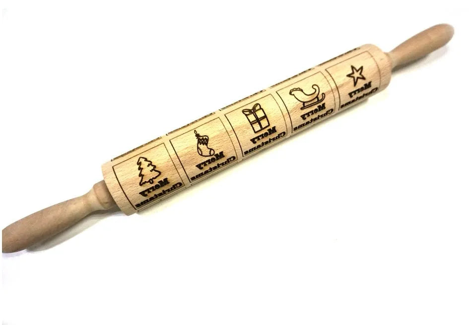 Wooden rolling pin with engraved Christmas patterns including reindeer and snowflakes on a 45cm long barrel.