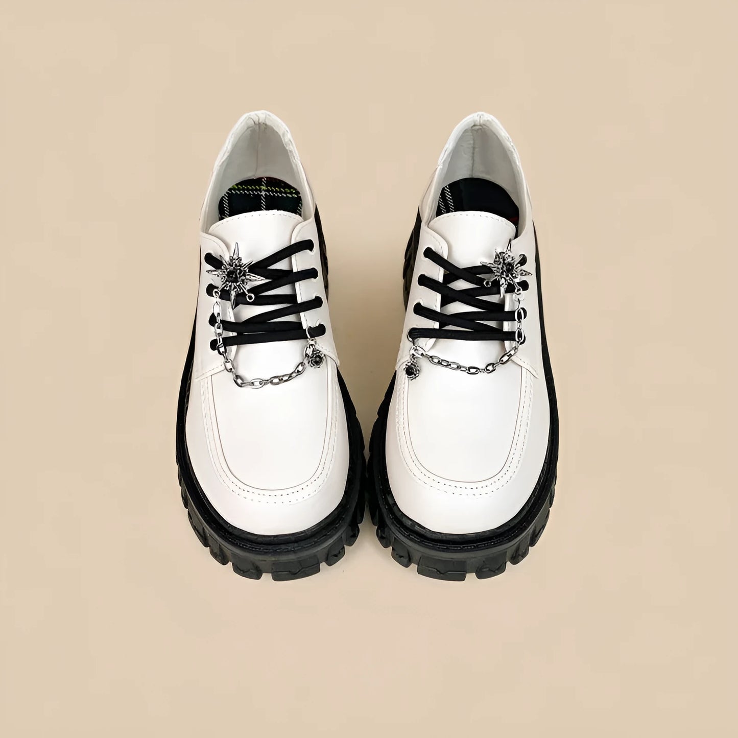 Women's Duke Asterism preppy loafers with a round toe and metal cross shoulder strap.