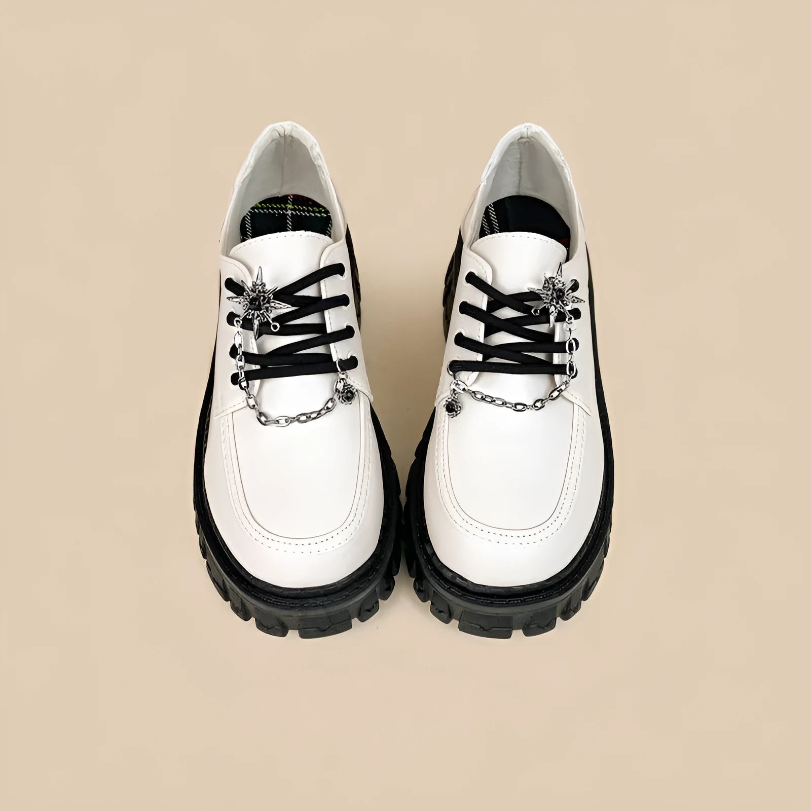Women's Duke Asterism preppy loafers with a round toe and metal cross shoulder strap.