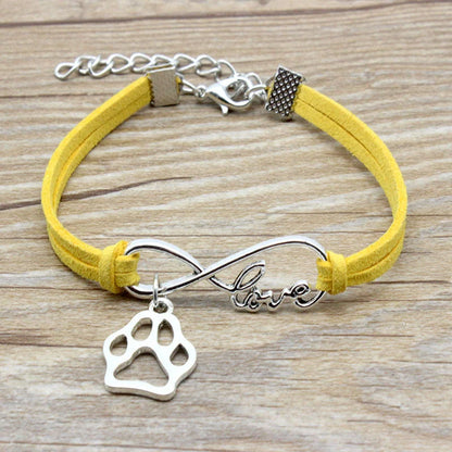 Hand-woven Infinite Love Pet Bracelet in various colors, showcasing the bow shape and alloy material.