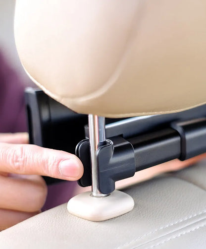 Black car tablet holder mounted on vehicle rear seat base holding iPad