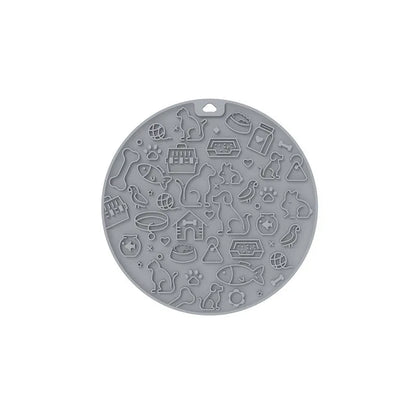 Round blue silicone pet licking mat with textured surface and suction base for slow feeding