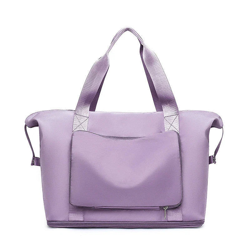 Roomy and foldable gym bag for women with waterproof Oxford fabric, multiple pockets, and wet/dry separation compartment