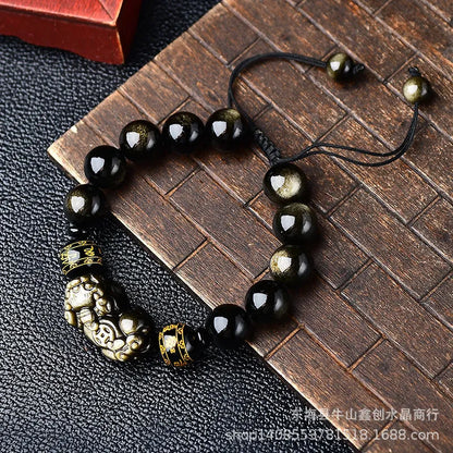 Hand-woven golden obsidian Pi Xiu bracelet with animal design, showing bead size options.