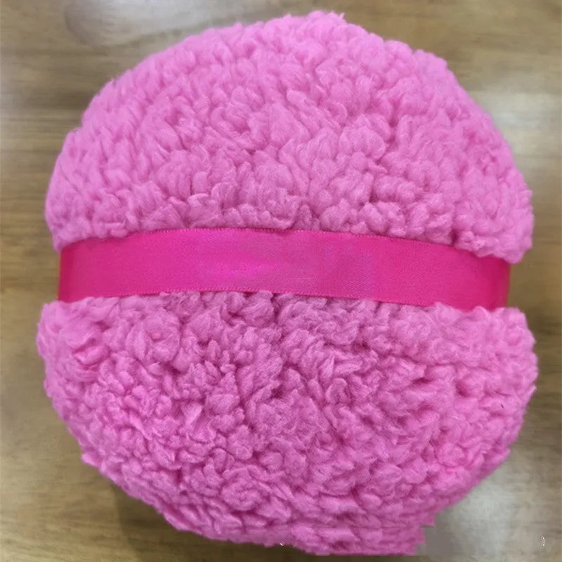 Oversized plush dry puff for makeup powder application in white colour, measuring 150mm by 75mm