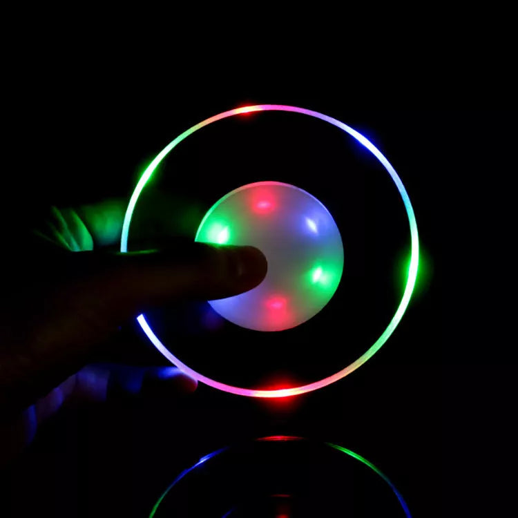 LED Glow Coaster with vibrant colors illuminating a cocktail glass