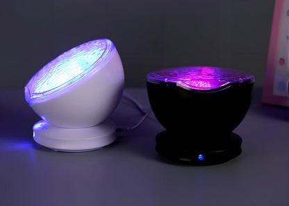 White and blue ocean wave projector measuring 13x12x12 cm with remote control