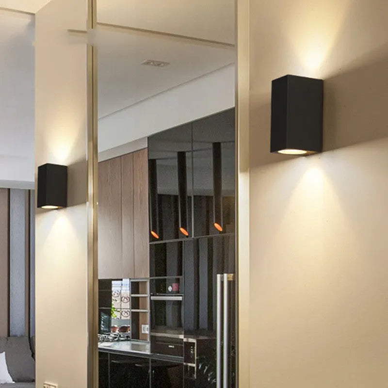 Black LED wall lamp with aluminium body and glass shade, available in 6W, 10W, or 12W power options with warm white or white light colour choices for versatile home or office lighting installation
