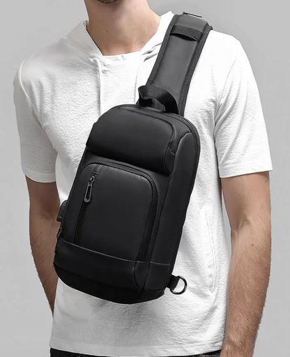Black outdoor leisure shoulder bag with air cushion strap and multiple internal compartments