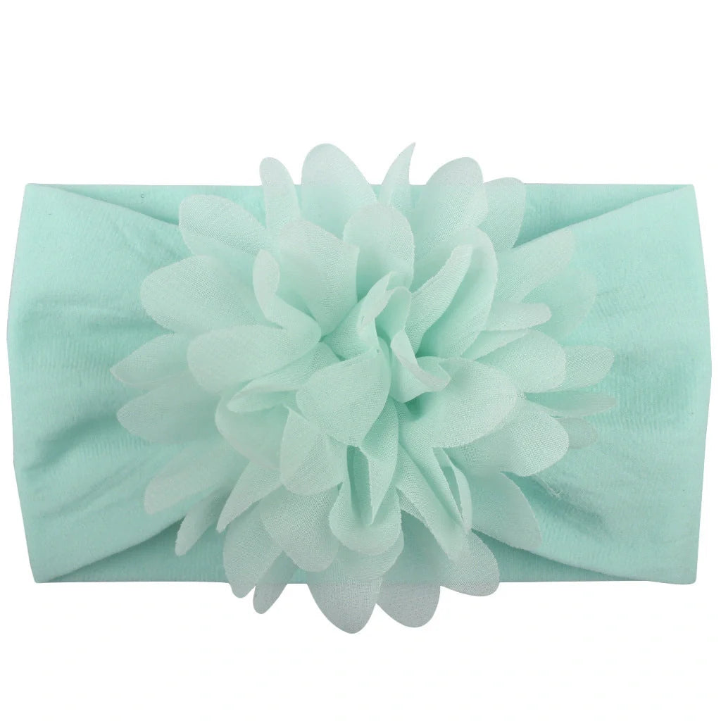 Adorable chiffon flower baby headband for your little princess, available in multiple colors.