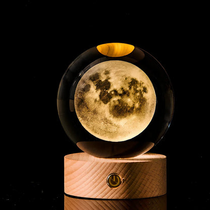 Transparent crystal ball with 3D laser inner carving of galaxy patterns on charging base